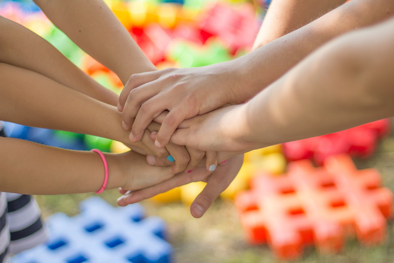 Hands interlocked together for support