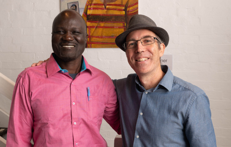 Artist and subject: Gora Odiel and Gabriel Hingley in front of the winning portrait. 