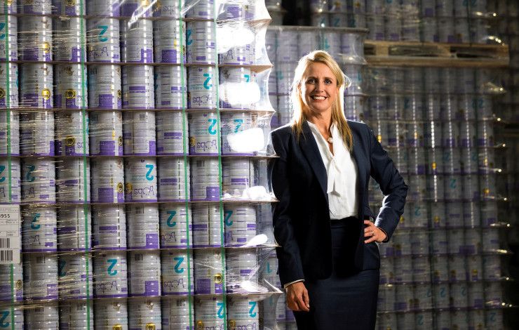 Lady standing in front of baby formula