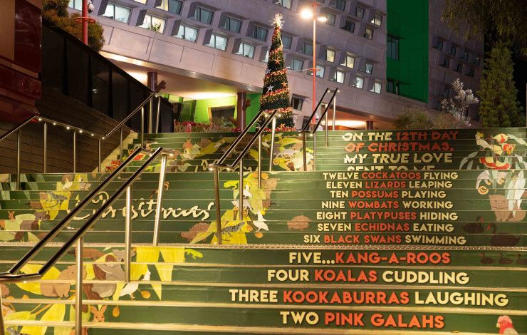Harmony Square steps decorated for Christmas lead up to a Christmas tree