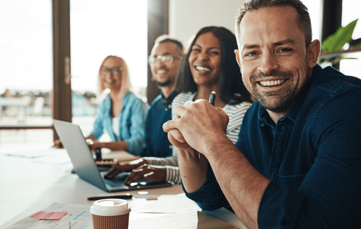 People sitting at a table in an office 