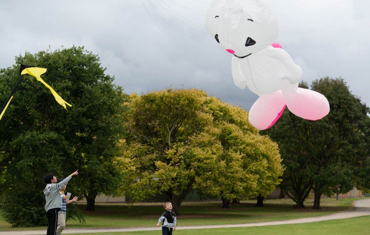an inflatable bunny kite flying above a reserve 