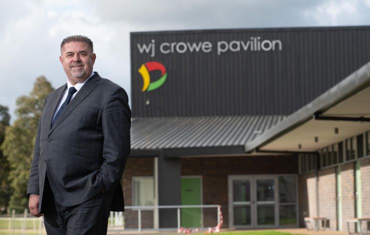 Councillor Jim Memeti in front of the WJ Crowe Pavilion