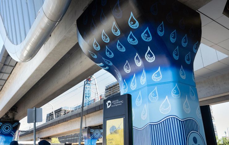 Muderra artwork on a concrete pole