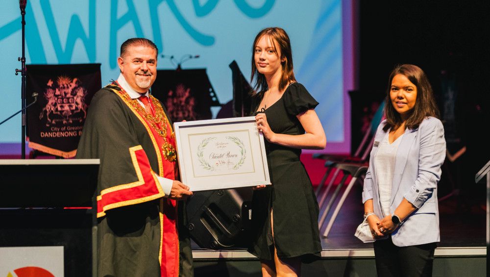 image of girl receiving an award from mayor
