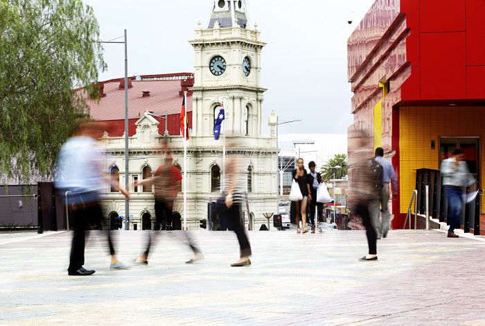 People walking in Harmony Square