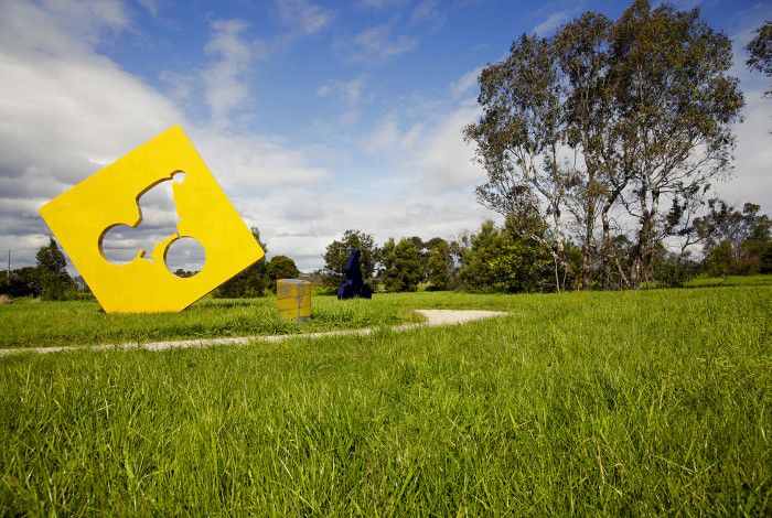 Public art 'Freedom Cycle Sculptures' yellow and blue cyclist sculptures