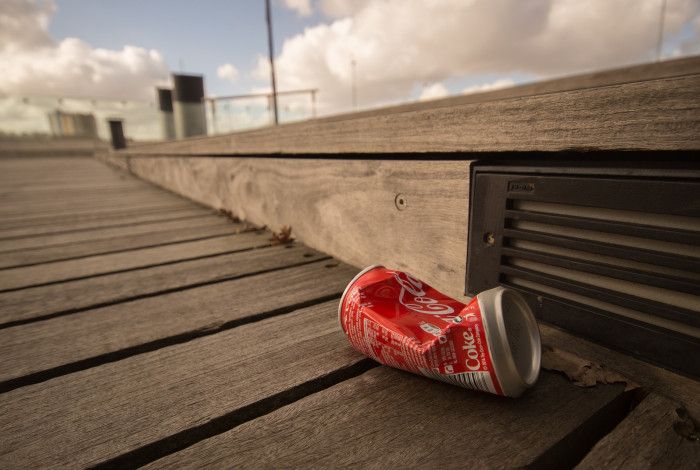 coke can dropped on walk way