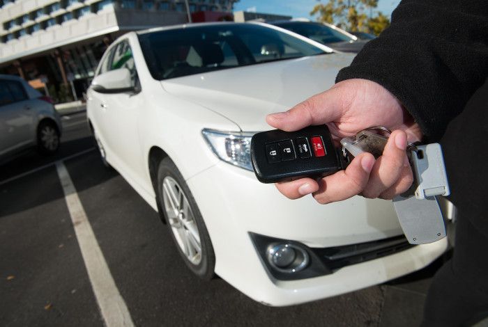 hand with car keys 