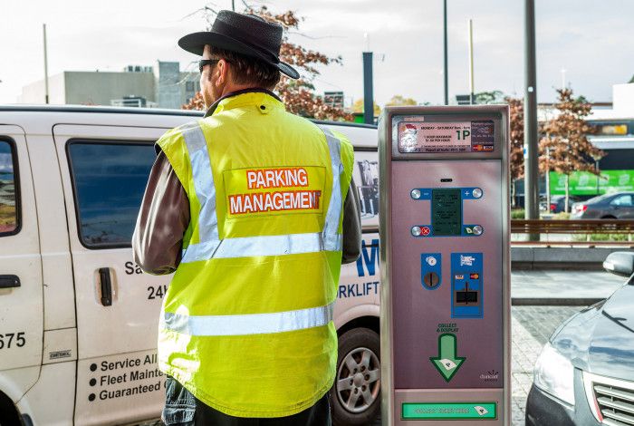 Parking officer with ticket machine