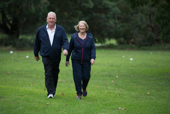 Senior couple walking in a park