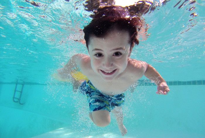 boy swimming in a pool