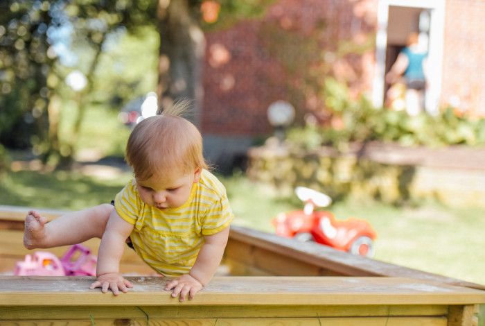 Toddler in a sand pit