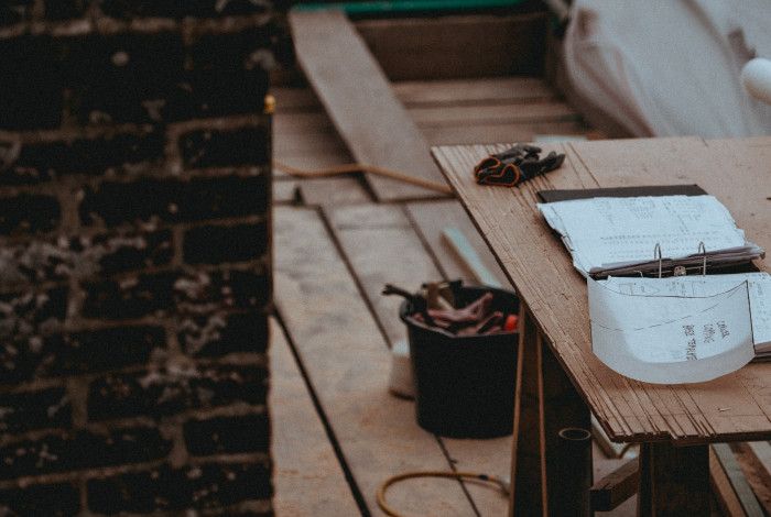 Building site with plans on a table