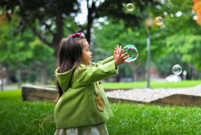 Girl making bubbles