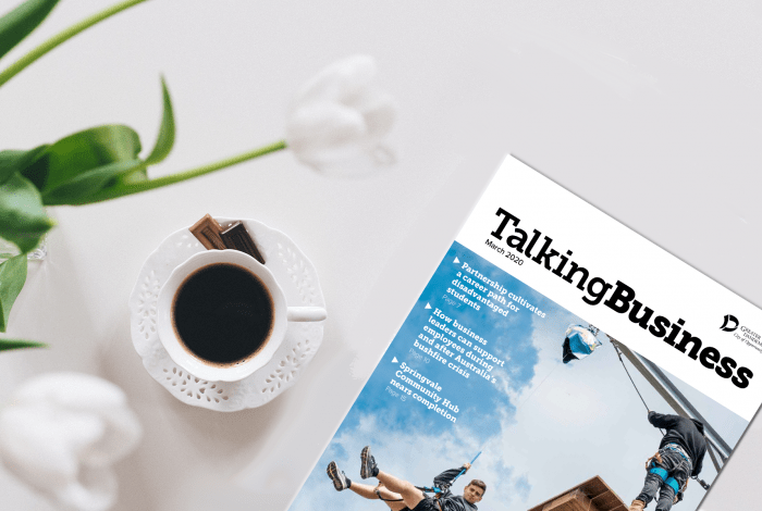 Talking Business magazine on a table with coffee