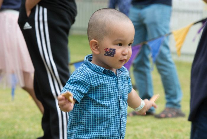 toddler with Australian flag tattoo on his cheek