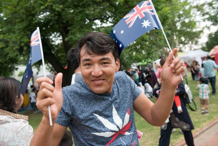 Man with Australian flags celebrating Australia Day