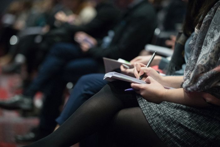 people sitting in a meeting