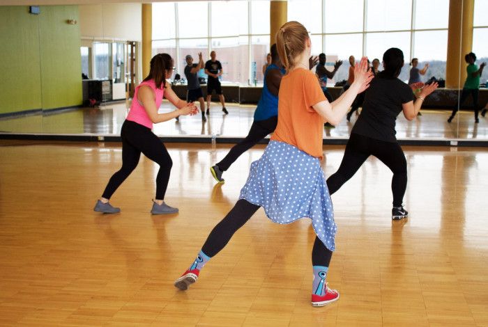 People exercising in a room.