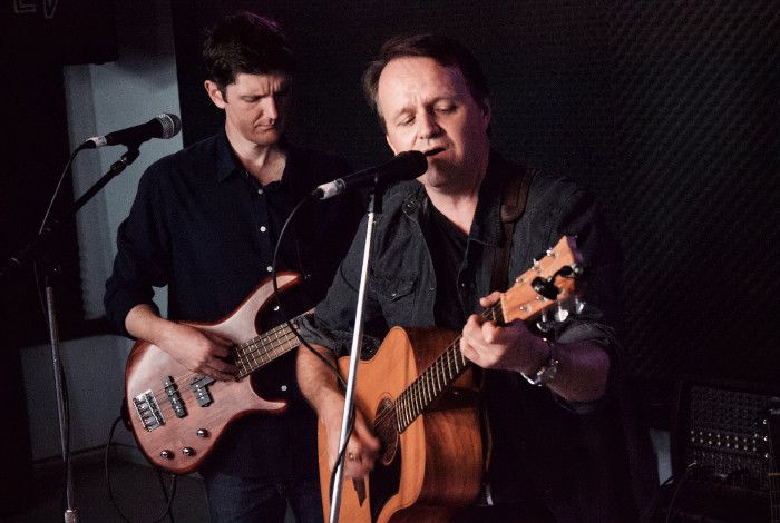 Men playing guitars