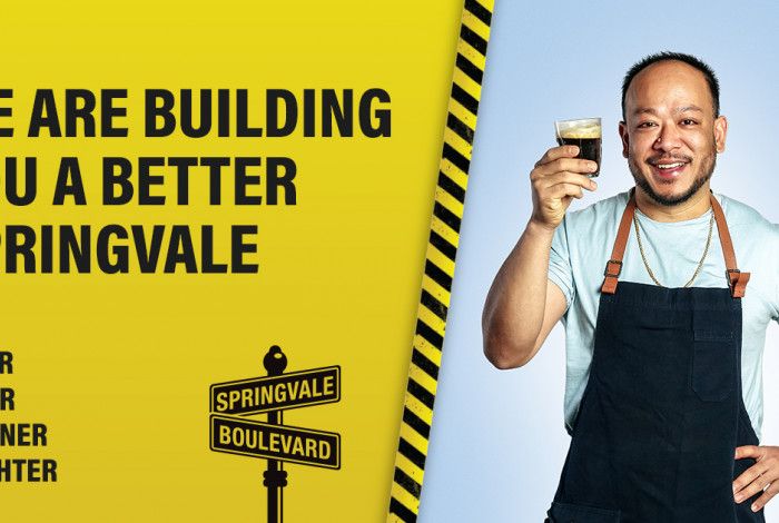 Picture of person with words, we are building you a better springvale