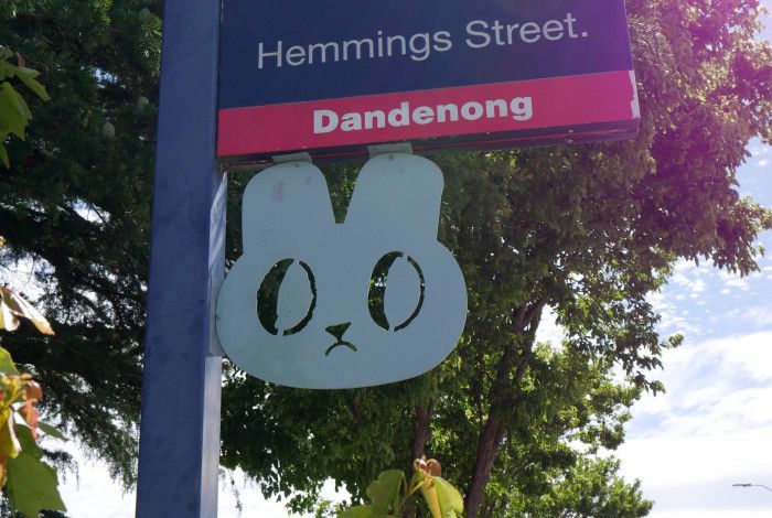 Street sign with sculpture 