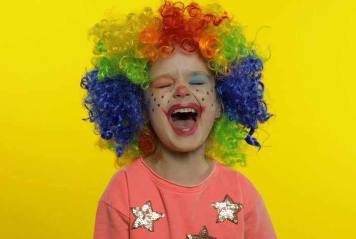 multicolour haired girl laughing loudly  