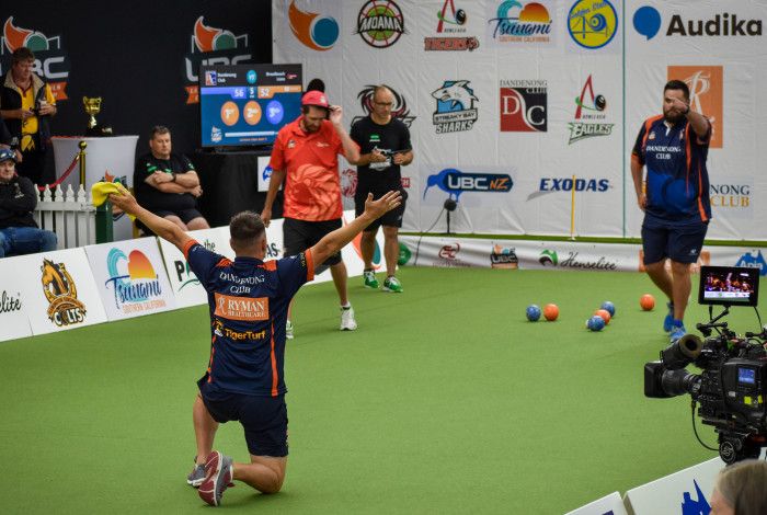 Men playing lawn bowls