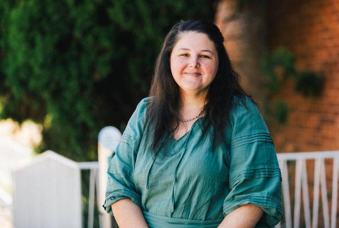 Amanda Meehan - woman in teal shirt 