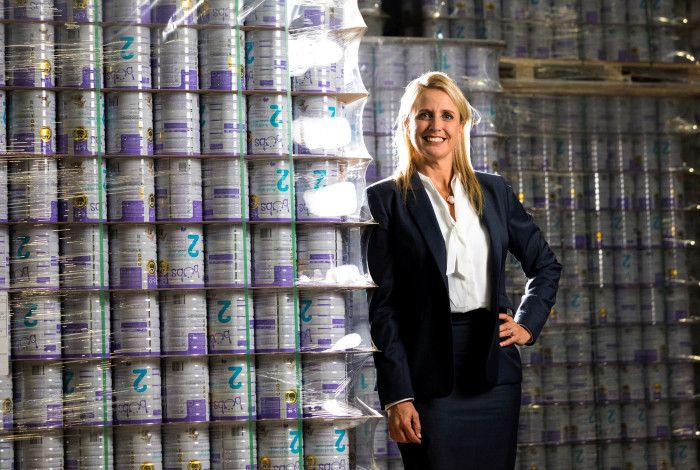 Lady standing in front of baby formula