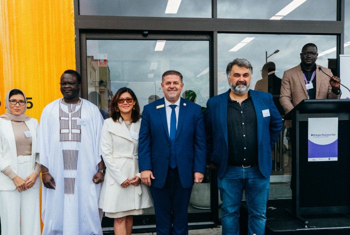 People at the refugee Resource Hub opening 