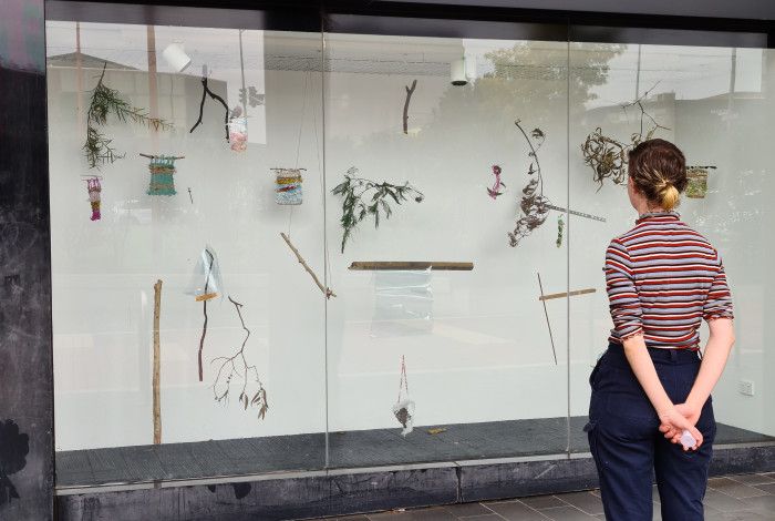 Person looking at the Harmony Square Display Windows