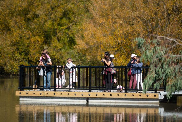 People enjoying fishing off the new jetty at the park 