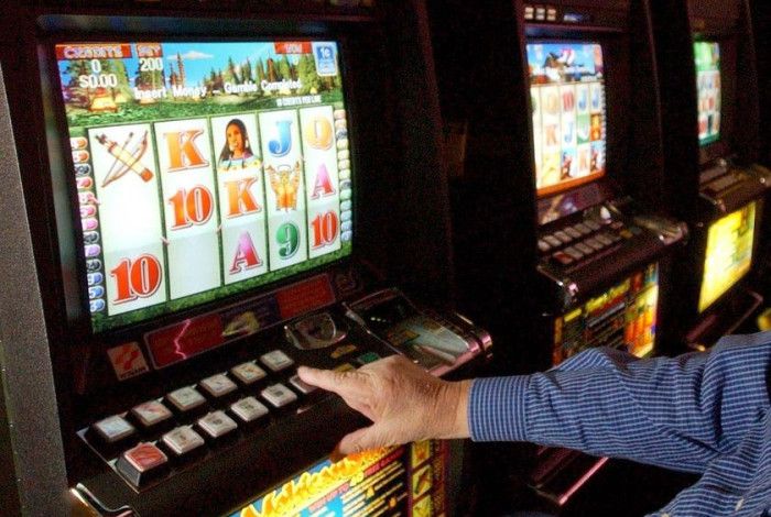 A person gambling at the pokies