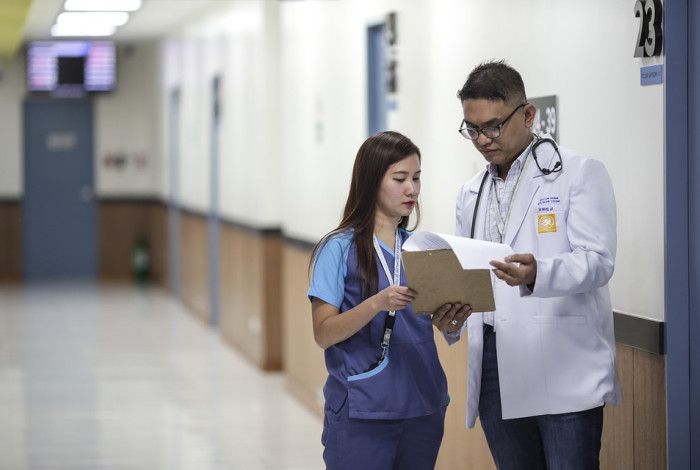 Doctor and nurse looking at paperwork