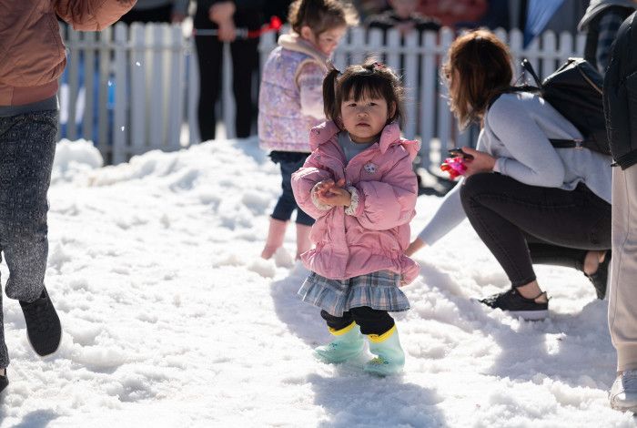child enjoying snow play area
