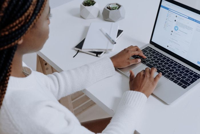 A person sitting at a laptop