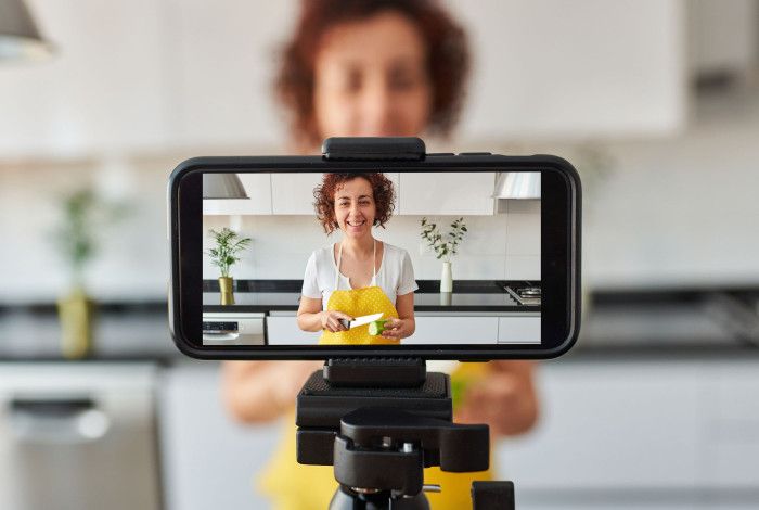 A person recording herself with smartphone
