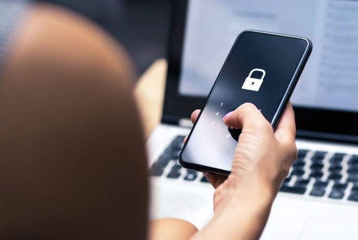 Person holding a phone on locked screen