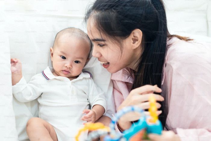 Toddler and mum playing