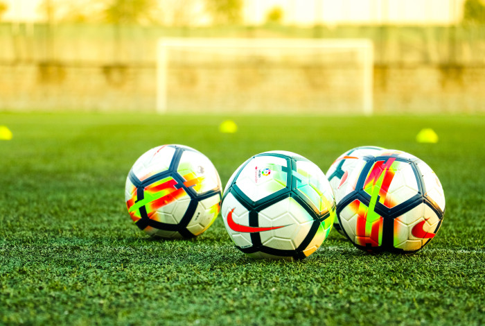 soccer balls on grass