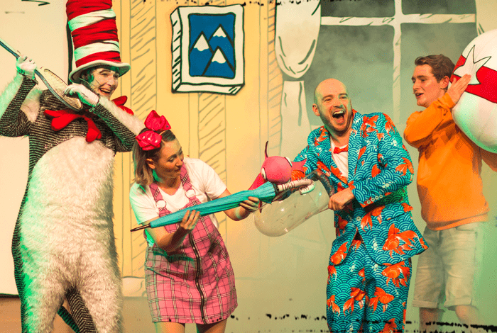 Brightly coloured characters from Dr Seuss, including the Cat in the Hat, onstage