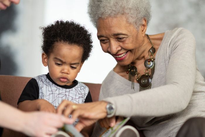 A grandmother reading with her grandson