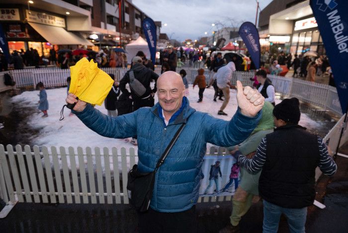 Councillor Sean O'Reilly in front of a snow play area at Springvale Snow Fest