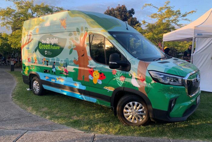 electric Van with Our Bright Green Future graphics on the side 