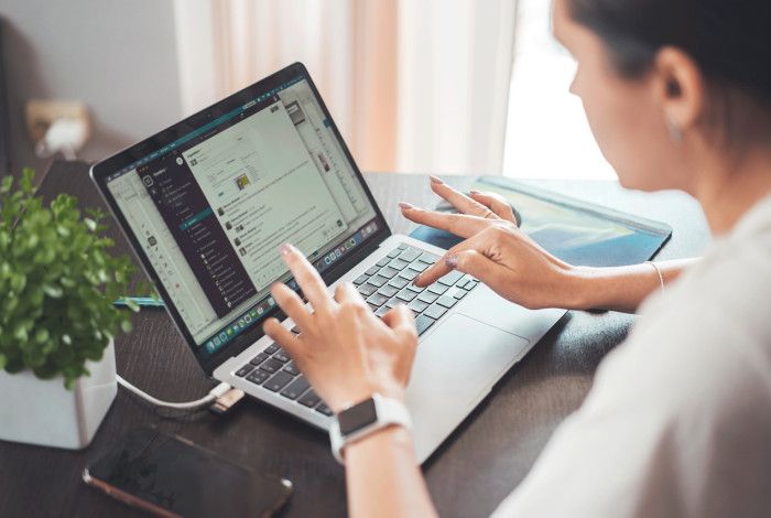 Person typing on a laptop