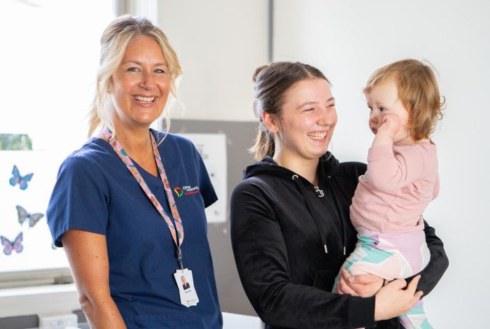 maternal health nurse with mother and baby