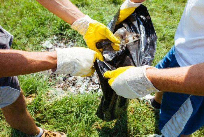 People holding rubbish