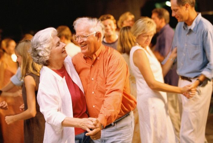 older man and lady dancing 